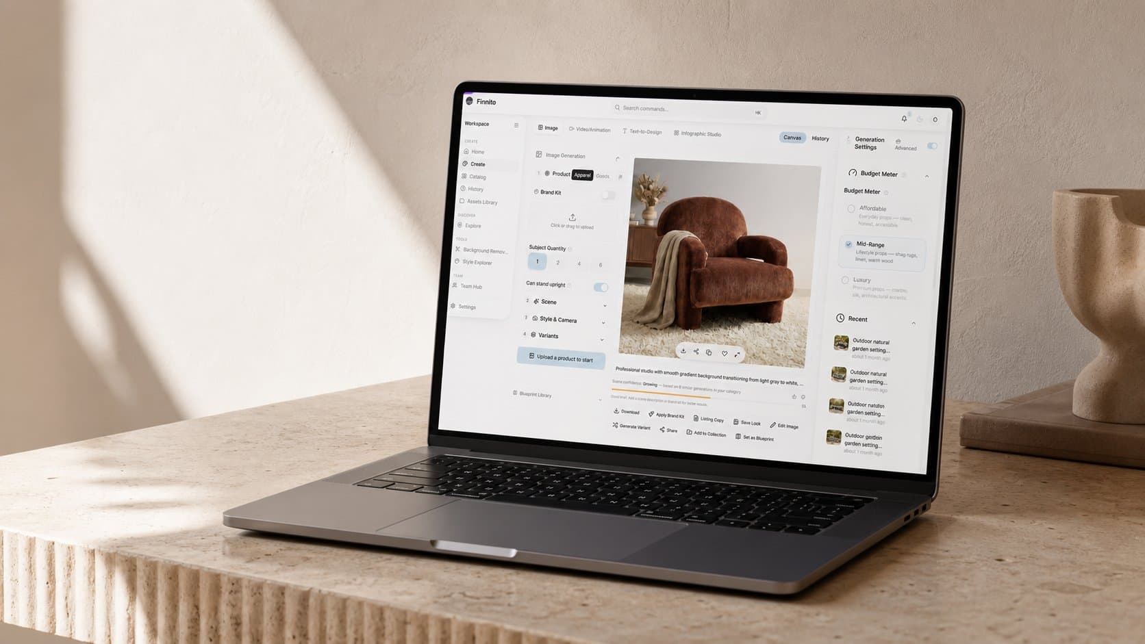 A laptop on a sunlit desk showing the Vision Studio interface generating a lifestyle scene for an armchair